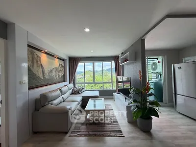 Spacious living room with modern decor and scenic window view in a stylish apartment.