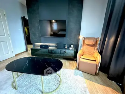 Modern living room with sleek TV setup and stylish furniture