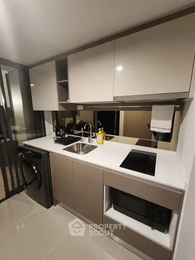 Modern kitchen with sleek cabinetry and built-in appliances