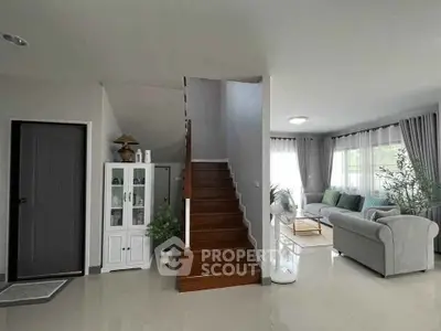 Modern living room with staircase and elegant decor