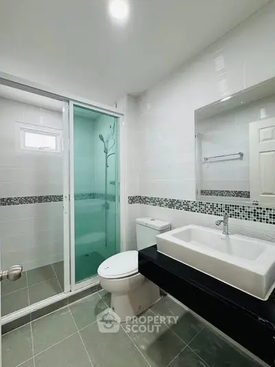Modern bathroom with sleek design and glass shower enclosure