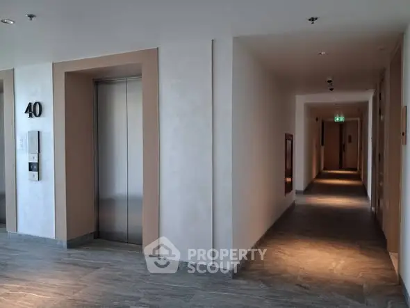 Modern apartment building corridor with elevator access on the 40th floor.