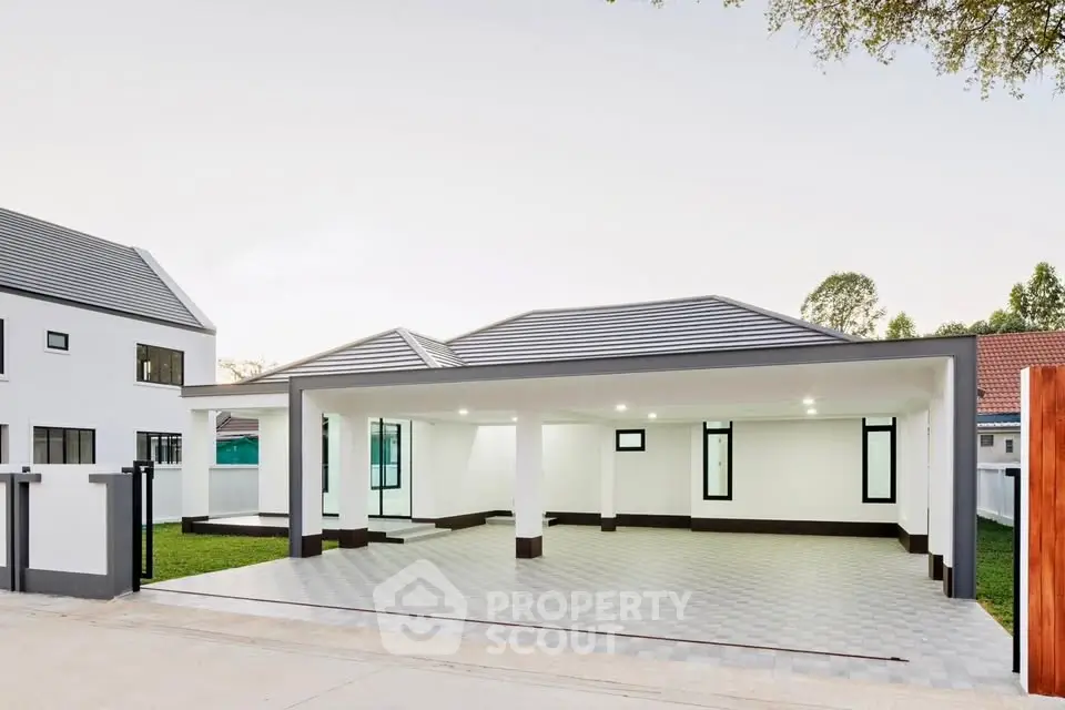 Modern minimalist house with spacious carport and sleek design