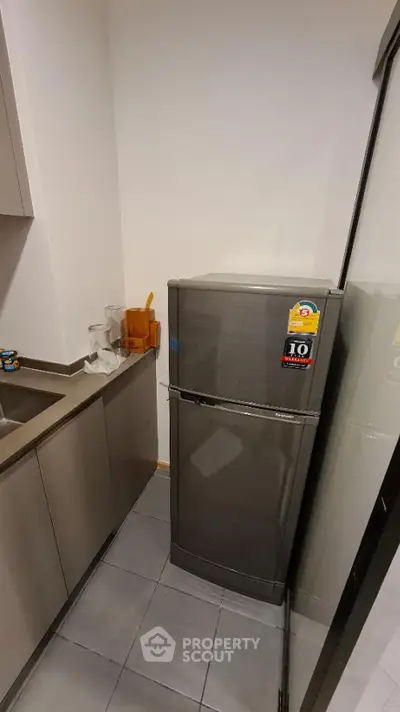 Modern kitchen with sleek fridge and minimalist design