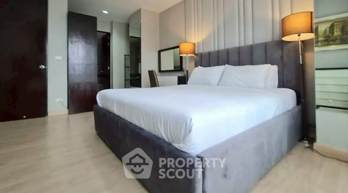 Spacious modern bedroom with elegant decor and cozy lighting