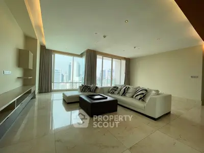 Luxurious living room with panoramic city views and elegant modern furnishings.
