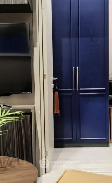 Stylish modern interior with blue cabinet and sleek decor