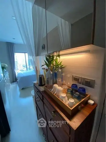 Chic bedroom with stylish decor and natural light, featuring a cozy bed and elegant furnishings.