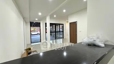 Spacious modern interior with sleek design and large windows for natural light.