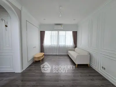 Elegant minimalist living room with white sofa and modern decor