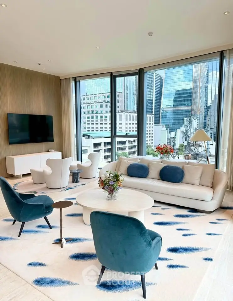 Luxurious modern living room with stunning city view, elegant furniture, and floor-to-ceiling windows.