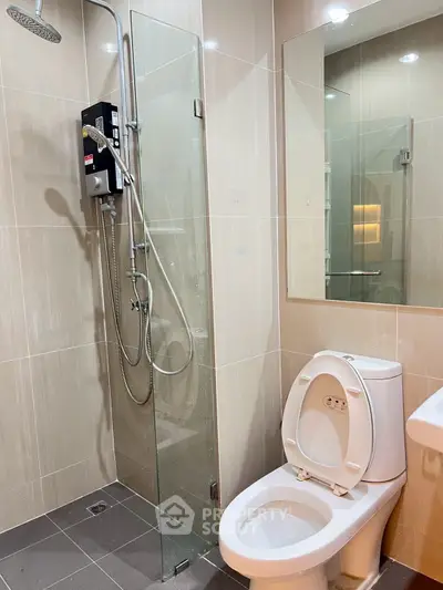 Modern bathroom with glass shower and sleek fixtures