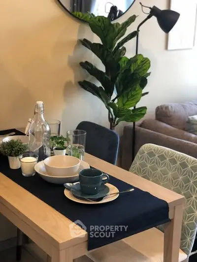 Chic dining area with modern decor and cozy seating in a stylish apartment.