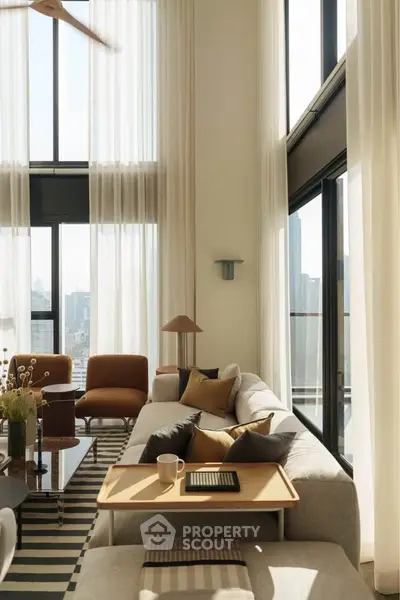 Luxurious high-ceiling living room with modern decor and stunning city view.