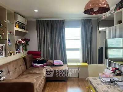 Cozy living room with modern decor and ample natural light