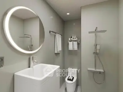 Modern bathroom with sleek fixtures and illuminated mirror in a contemporary apartment.