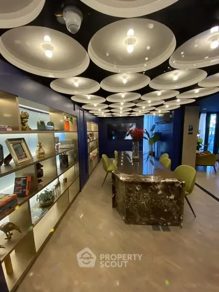 Luxurious modern living room with unique ceiling design and elegant decor