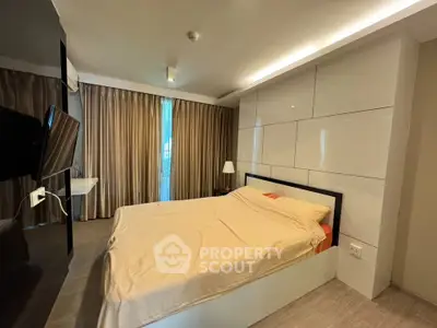 Modern bedroom with sleek design and large window for natural light