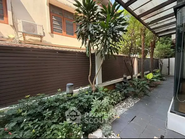 Charming garden with lush greenery and modern design in urban setting