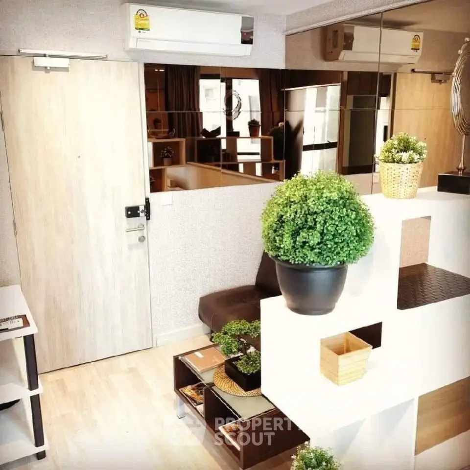 Modern living room with stylish decor and indoor plants, featuring a cozy seating area and contemporary design.