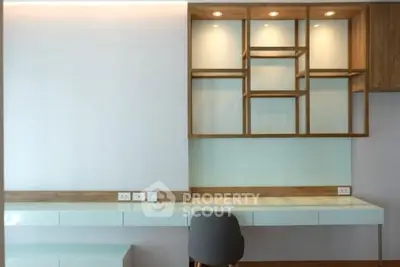 Modern study room with sleek built-in desk and shelving