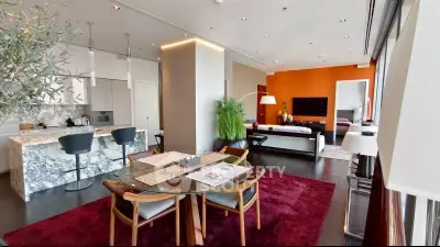 Luxurious open-plan living room with modern kitchen and vibrant decor