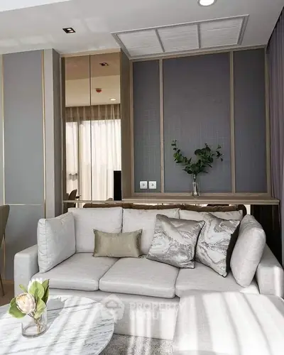Elegant living room with modern decor and plush sofa in a stylish apartment.