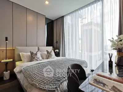 Luxurious modern bedroom with floor-to-ceiling windows and elegant decor