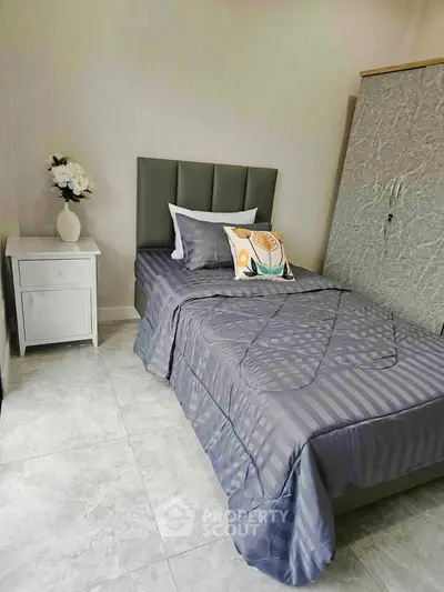 Cozy bedroom with modern decor and stylish bedding