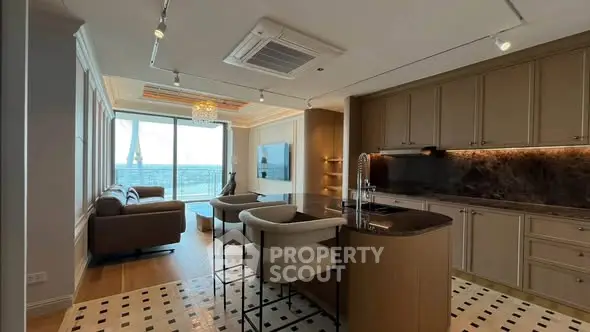 Luxurious open-layout kitchen and living room with stunning view and modern design.