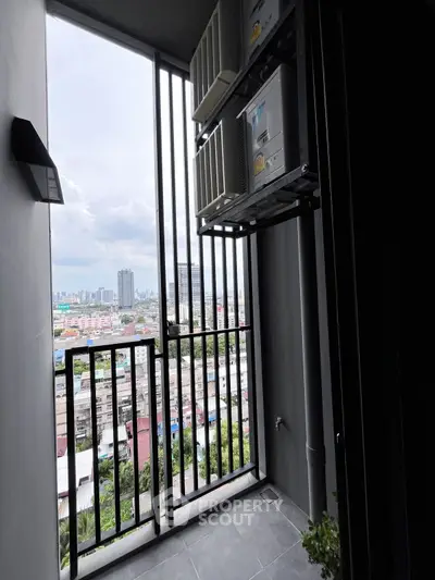 Modern balcony with city view and air conditioning units, ideal for urban living.
