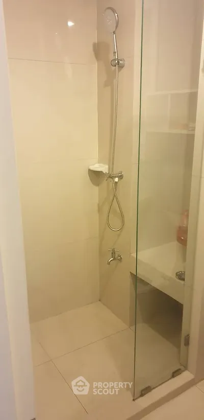 Modern bathroom with sleek shower design and glass partition