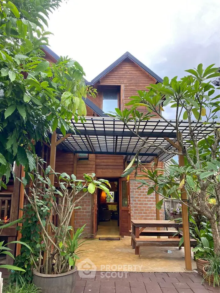 Charming wooden house with lush garden and inviting entrance