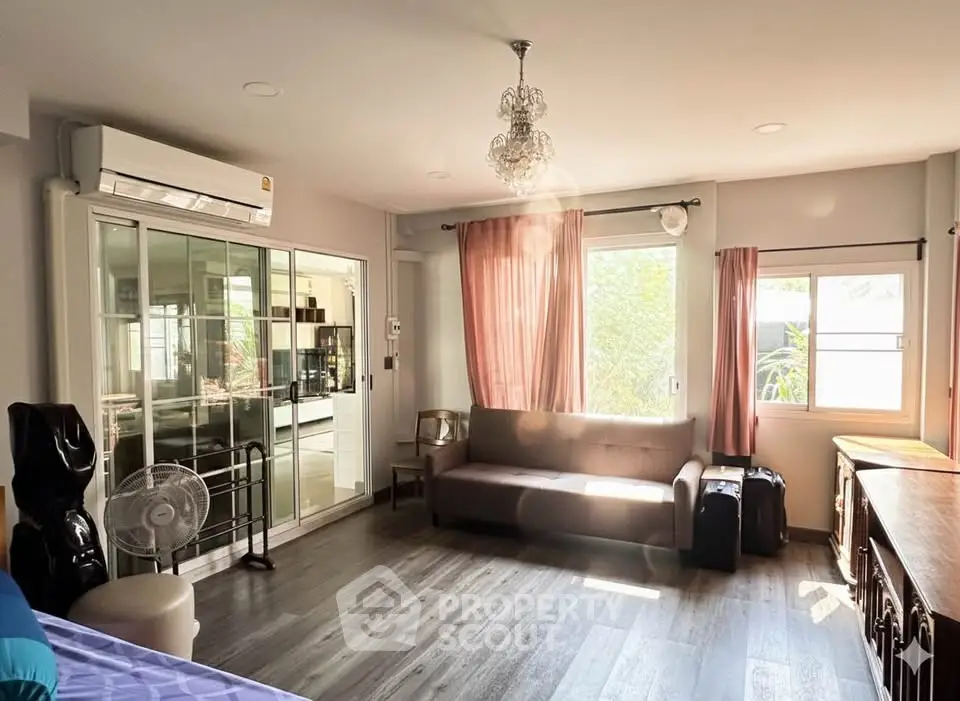 Spacious living room with modern decor and natural light