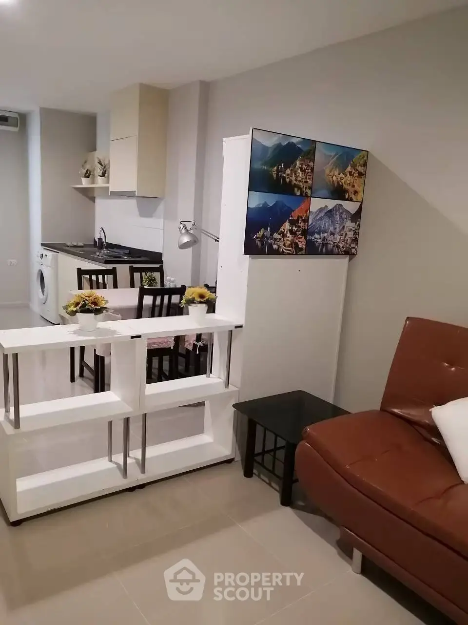 Modern living room with open kitchen and stylish decor in cozy apartment