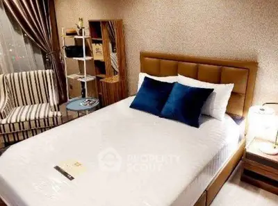 Cozy bedroom with modern decor and comfortable bed in stylish apartment.