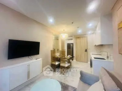 Modern living room with elegant dining area and sleek kitchen in open layout apartment.