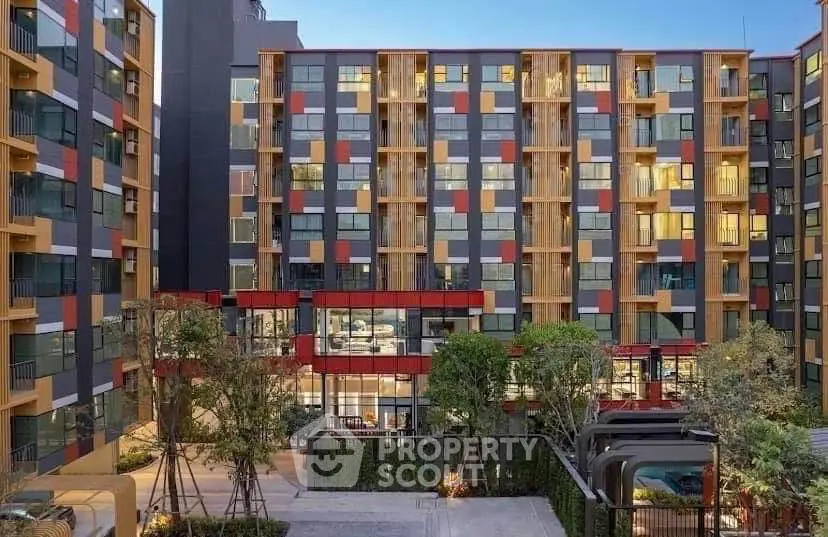 Modern apartment building with colorful facade and landscaped courtyard