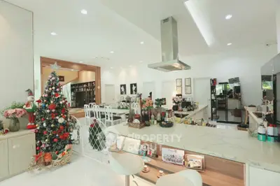 Spacious modern kitchen with elegant island and festive Christmas decor