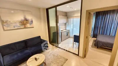 Modern apartment with cozy living room, sleek kitchen, and elegant bedroom.