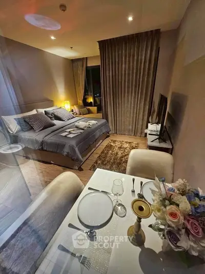Luxurious bedroom with elegant dining area and ambient lighting