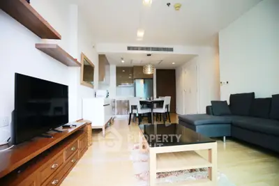 Spacious modern living room with open kitchen and stylish furniture