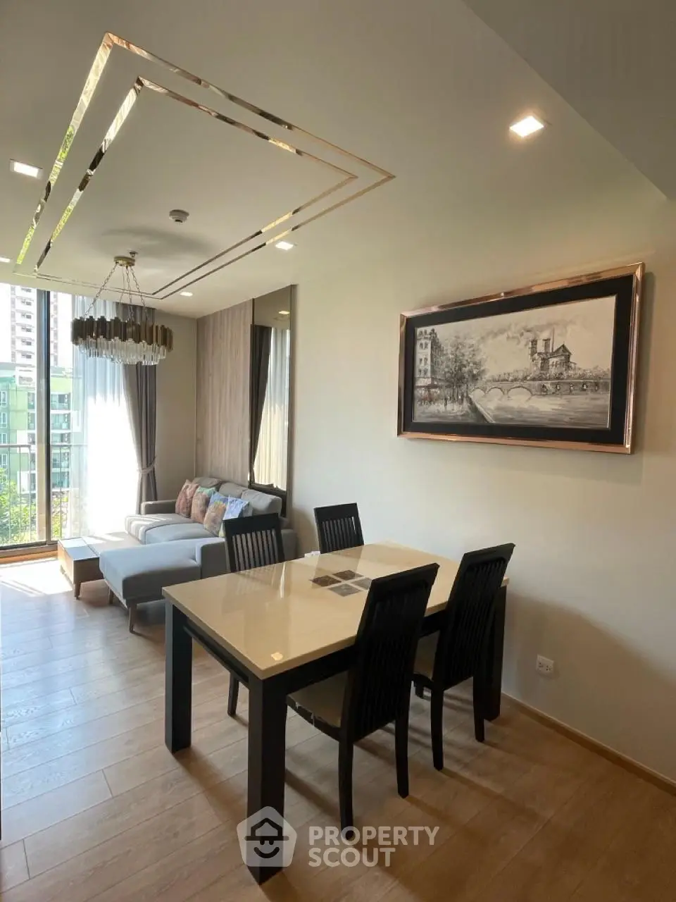 Modern living room with elegant dining area and large window view