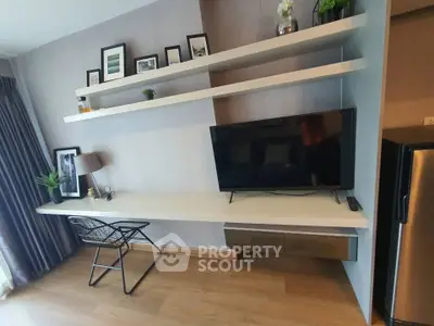 Modern living room with sleek TV setup and stylish shelving