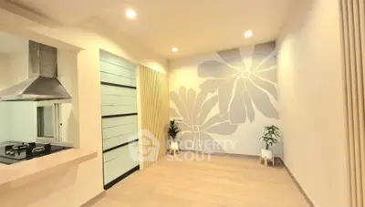 Modern kitchen with sleek design and artistic wall decor