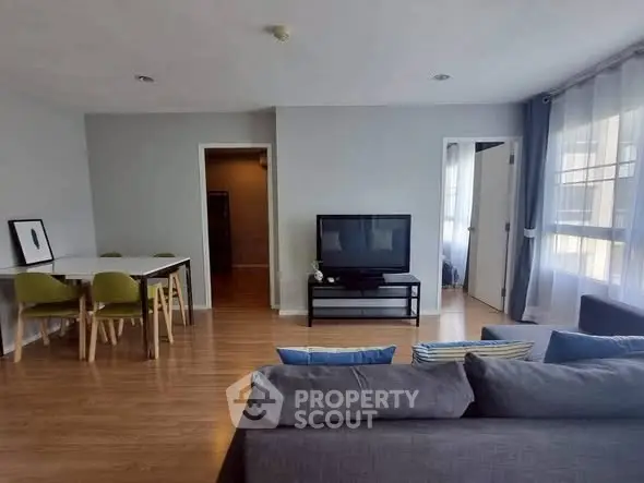 Spacious living room with modern decor and natural light