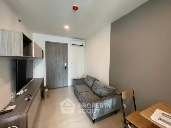 Modern living room with sleek furniture and neutral tones, perfect for urban living.