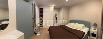 Cozy bedroom with modern decor and ample storage space