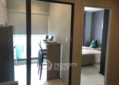 Modern apartment interior with cozy bedroom and dining area, perfect for urban living.