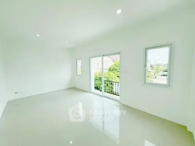 Spacious empty room with large windows and glossy tiled floor, perfect for customization.